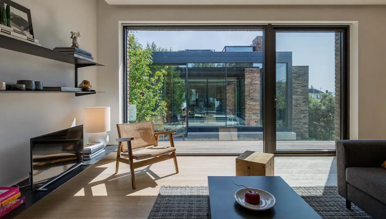 Bright living room with a large double glazed bay window